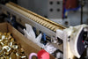 Whistles lined up on conveyor